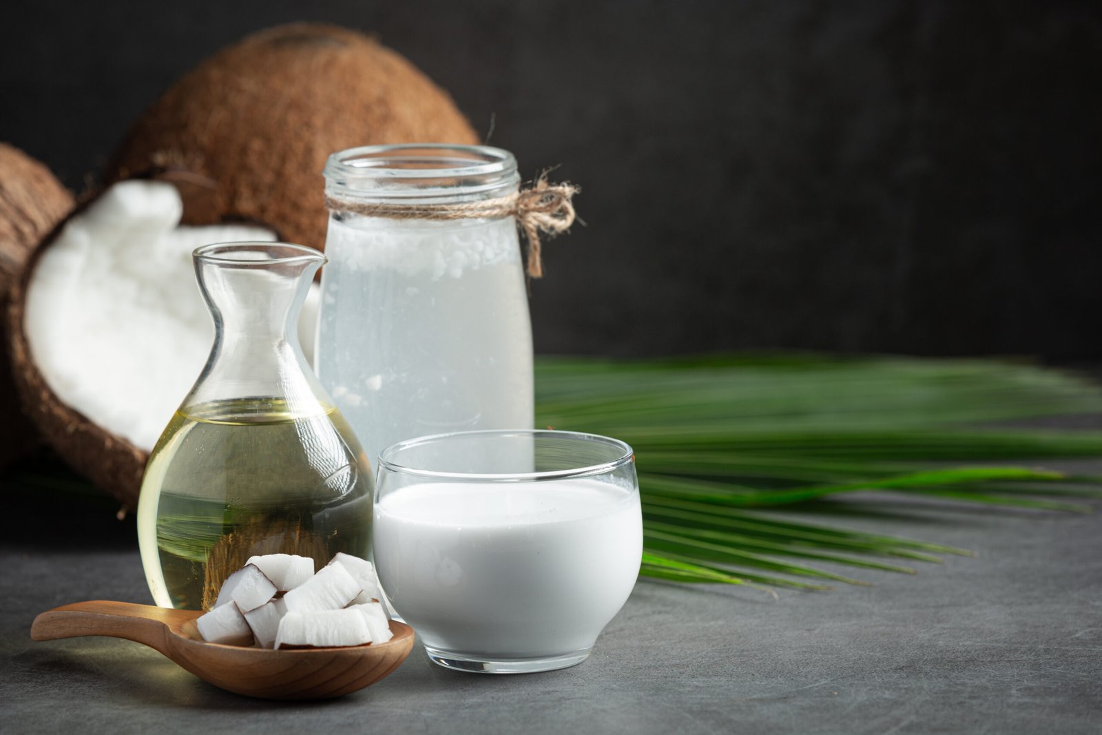 various types products from coconut put on dark floor